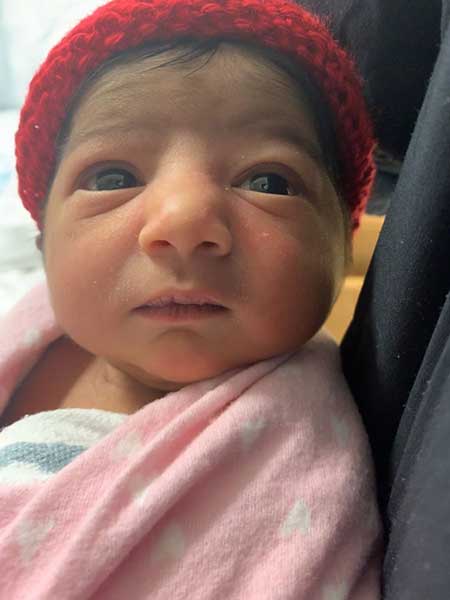 Newborn Baby with a red hat